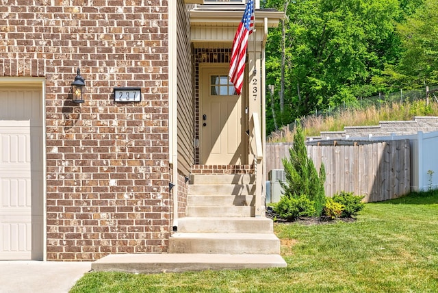 237 Wade Hampton Ln, Clarksville, TN 37040 - entrance to property with fence, a garage, central AC, and brick siding