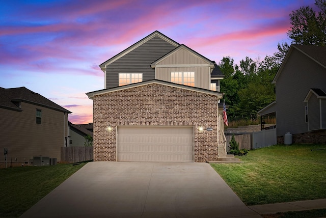 237 Wade Hampton Ln, Clarksville, TN 37040 - traditional home with a front lawn, fence, brick siding, board and batten siding, and driveway