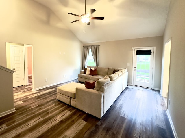 living area featuring high vaulted ceiling, a ceiling fan, dark wood-style floors, and plenty of natural light