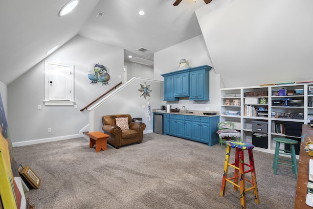 living area with visible vents, carpet floors, vaulted ceiling, a ceiling fan, and stairs