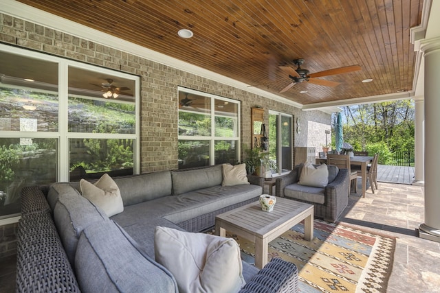 view of patio / terrace with an outdoor hangout area, a ceiling fan, and outdoor dining space
