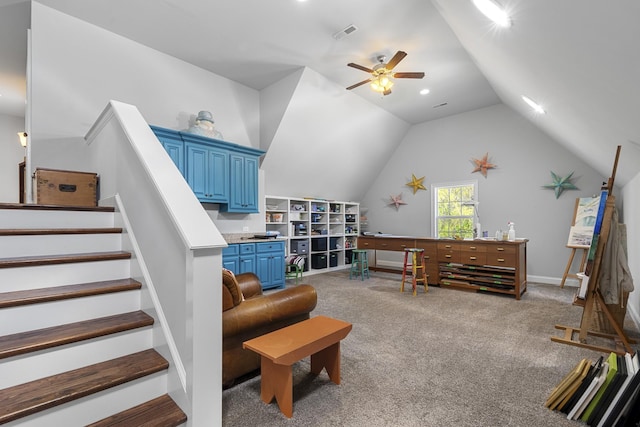 interior space featuring carpet floors, ceiling fan, stairs, visible vents, and lofted ceiling
