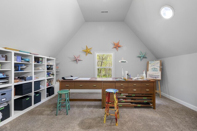 carpeted home office featuring visible vents and vaulted ceiling