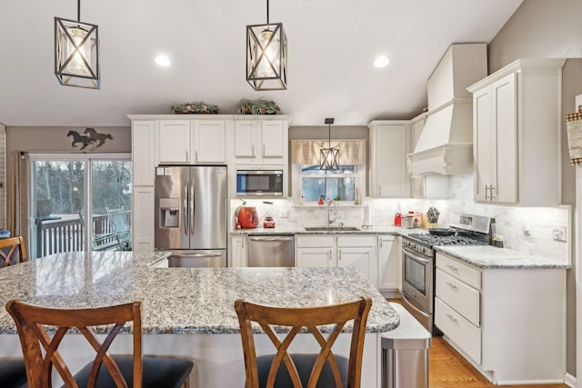 843 Percy Warner Blvd, Nashville, TN 37205 - kitchen with appliances with stainless steel finishes, a sink, white cabinets, backsplash, and recessed lighting