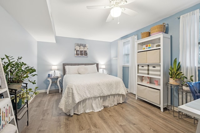 843 Percy Warner Blvd, Nashville, TN 37205 - bedroom with light wood-type flooring, multiple windows, baseboards, and ceiling fan