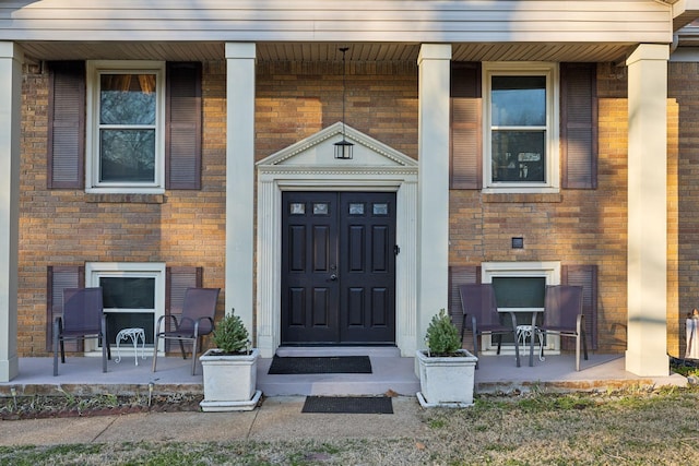 843 Percy Warner Blvd, Nashville, TN 37205 - doorway to property with covered porch and brick siding