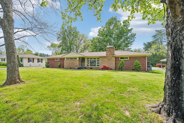 909 Hillsboro Rd, Franklin, TN 37064 - view of front of home with brick siding, a chimney, a front yard, and crawl space