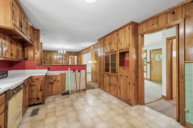 909 Hillsboro Rd, Franklin, TN 37064 - kitchen featuring brown cabinetry, light floors, an inviting chandelier, light countertops, and dishwashing machine