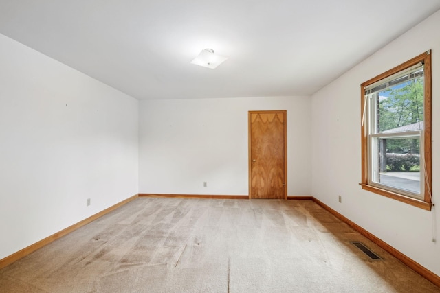 909 Hillsboro Rd, Franklin, TN 37064 - empty room featuring baseboards, visible vents, and light colored carpet