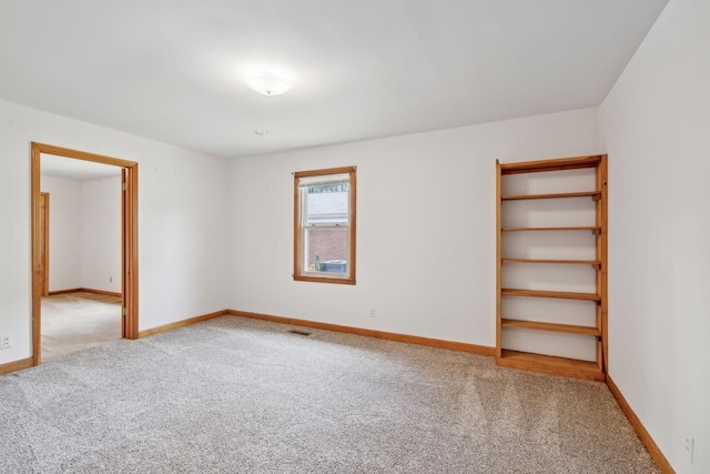 909 Hillsboro Rd, Franklin, TN 37064 - carpeted empty room with visible vents and baseboards