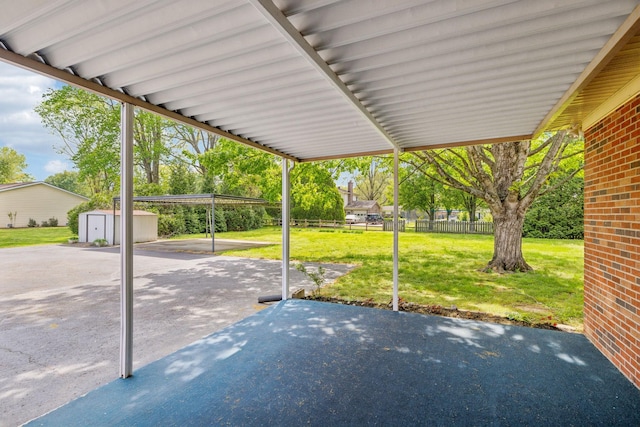 909 Hillsboro Rd, Franklin, TN 37064 - view of patio featuring an outbuilding, a shed, and fence