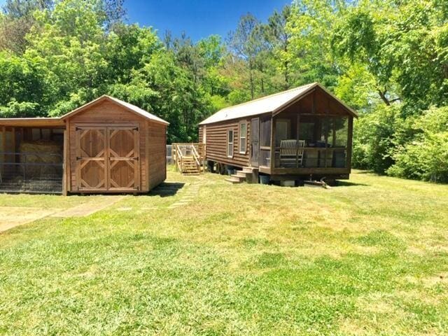 5755 Railroad St, Williston, TN 38076 - view of grassy yard featuring a wooden deck