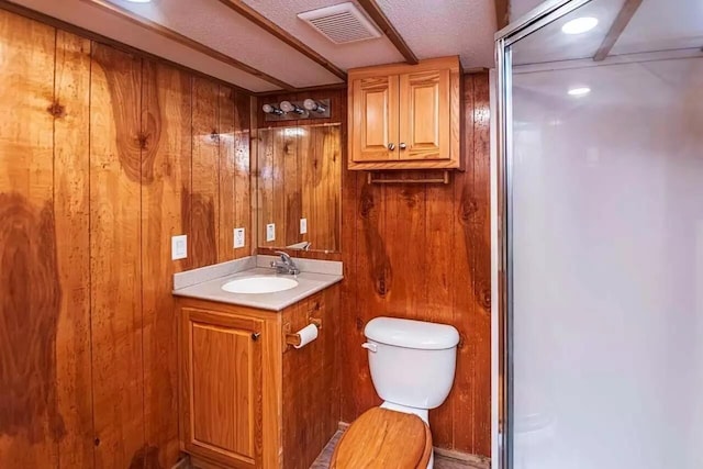 5755 Railroad St, Williston, TN 38076 - full bathroom featuring toilet, vanity, wood walls, and an enclosed shower