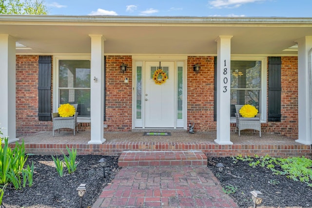 1803 W Lori Lee Dr, Gallatin, TN 37066 - doorway to property with a porch and brick siding