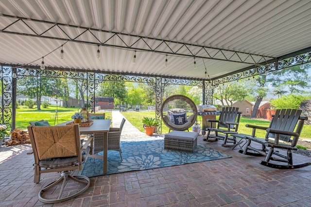 1803 W Lori Lee Dr, Gallatin, TN 37066 - view of patio with a fenced backyard, a storage unit, outdoor dining area, and an outbuilding