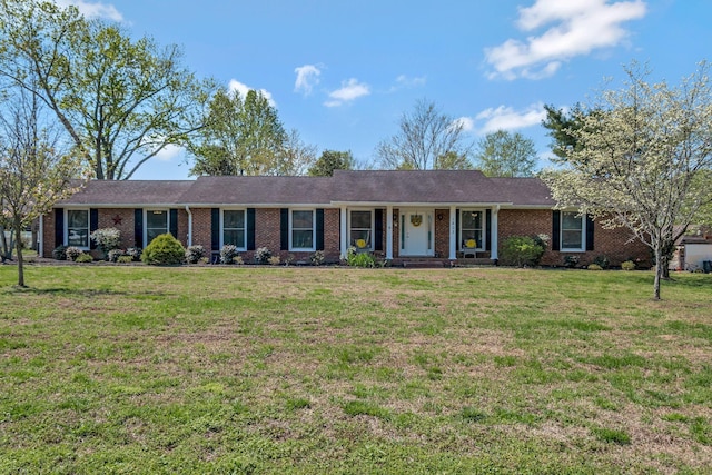 1803 W Lori Lee Dr, Gallatin, TN 37066 - ranch-style home featuring a front lawn, brick siding, and a porch