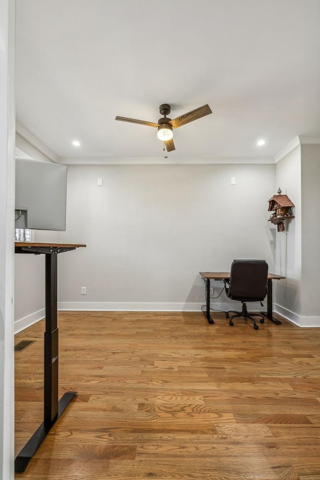 office space featuring ornamental molding, ceiling fan, recessed lighting, light wood-style flooring, and baseboards
