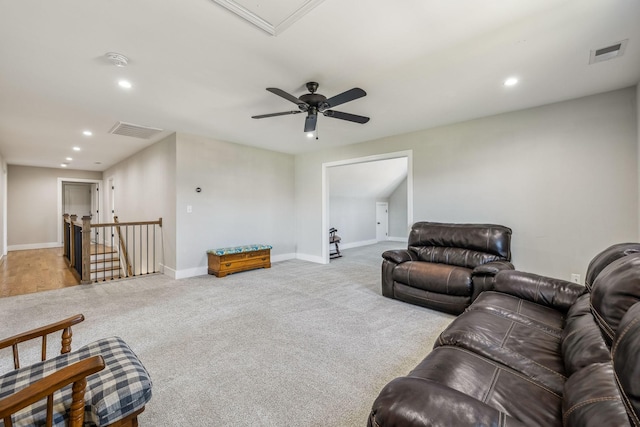 carpeted living room featuring recessed lighting, baseboards, a ceiling fan, and attic access