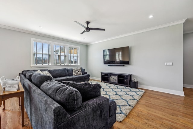 living room with ceiling fan, ornamental molding, wood finished floors, baseboards, and recessed lighting