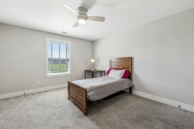 carpeted bedroom with baseboards and ceiling fan