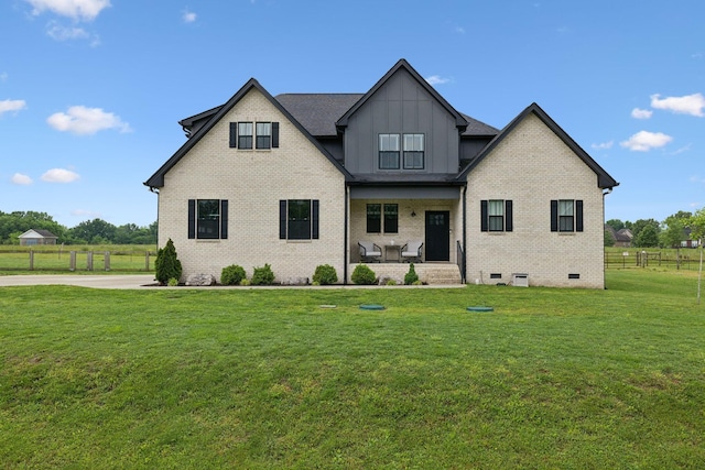 view of front of house with board and batten siding, brick siding, covered porch, and crawl space