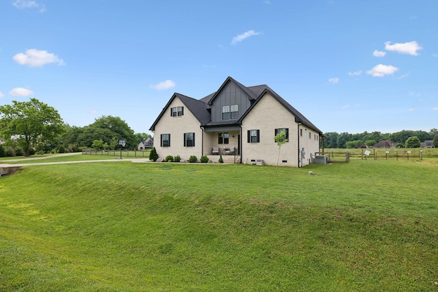 modern inspired farmhouse with brick siding, central air condition unit, and board and batten siding