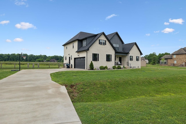 view of front of home with a garage, concrete driveway, a front yard, and board and batten siding