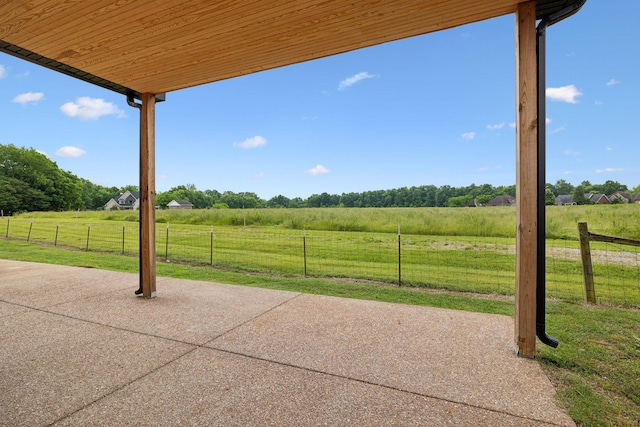 view of patio / terrace featuring a view of rural / pastoral area