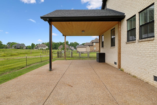 view of patio / terrace featuring a residential view and central AC unit