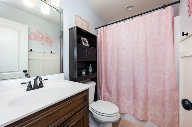 bathroom with toilet and vanity