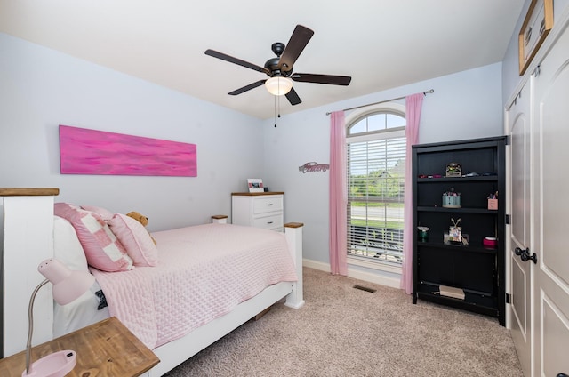 bedroom featuring visible vents, carpet floors, and ceiling fan