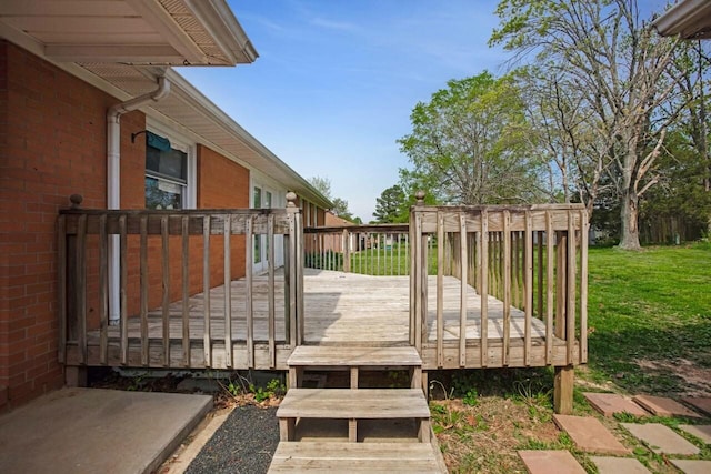 deck featuring a lawn