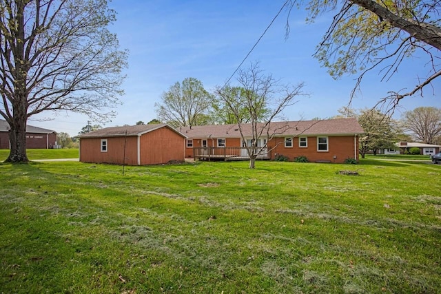 view of yard with a wooden deck