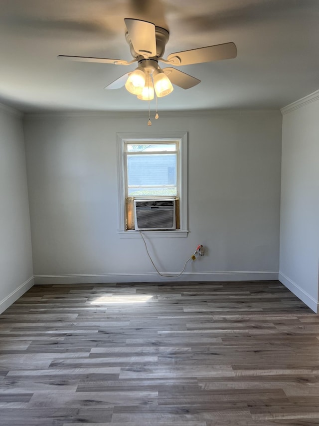 unfurnished room with wood finished floors, crown molding, cooling unit, and ceiling fan