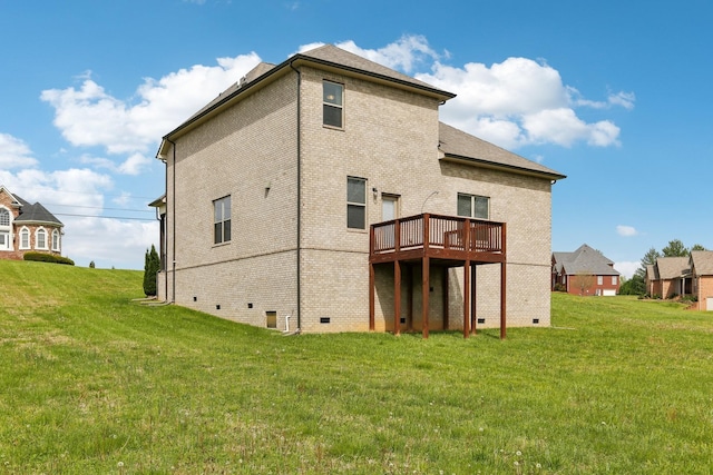 back of house with brick siding, a yard, crawl space, and a wooden deck
