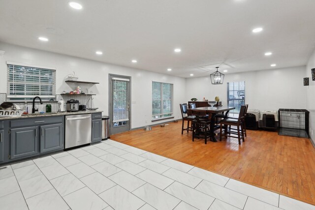4726 Hickory Ln, Murfreesboro, TN 37129 - kitchen with stainless steel dishwasher, a sink, recessed lighting, gray cabinetry, and light tile patterned floors