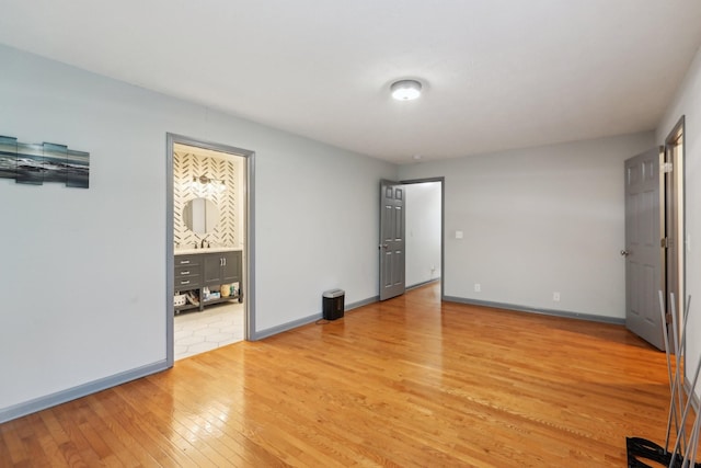 4726 Hickory Ln, Murfreesboro, TN 37129 - unfurnished bedroom featuring light wood-style flooring, baseboards, and ensuite bath