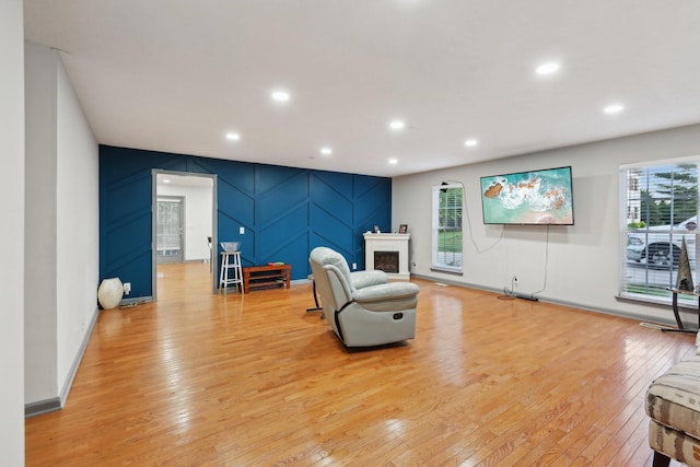 4726 Hickory Ln, Murfreesboro, TN 37129 - living area with a decorative wall, light wood-type flooring, recessed lighting, and a fireplace
