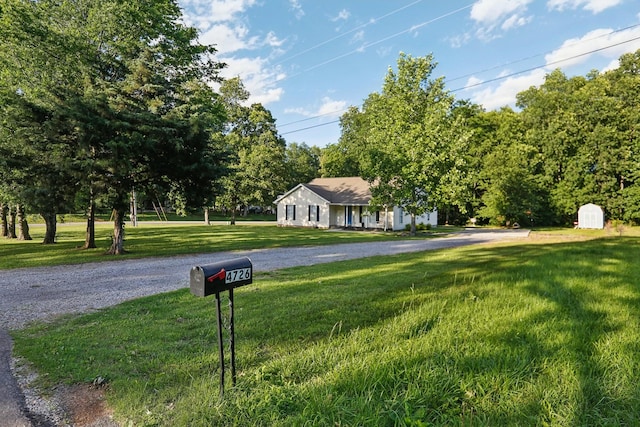 4726 Hickory Ln, Murfreesboro, TN 37129 - view of front of home featuring a front lawn and a storage shed