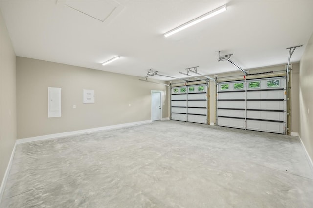 305 Georgee Rd, Jamestown, TN 38556 - garage with a garage door opener, baseboards, and electric panel