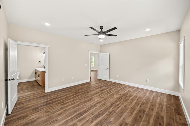 305 Georgee Rd, Jamestown, TN 38556 - unfurnished bedroom with dark wood-style floors, baseboards, recessed lighting, a sink, and connected bathroom
