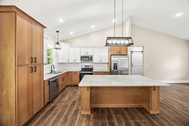 305 Georgee Rd, Jamestown, TN 38556 - kitchen featuring stainless steel appliances, lofted ceiling, a sink, a kitchen island, and dark wood-style floors