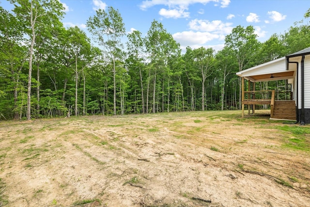 305 Georgee Rd, Jamestown, TN 38556 - view of yard with stairway, a deck, and a view of trees