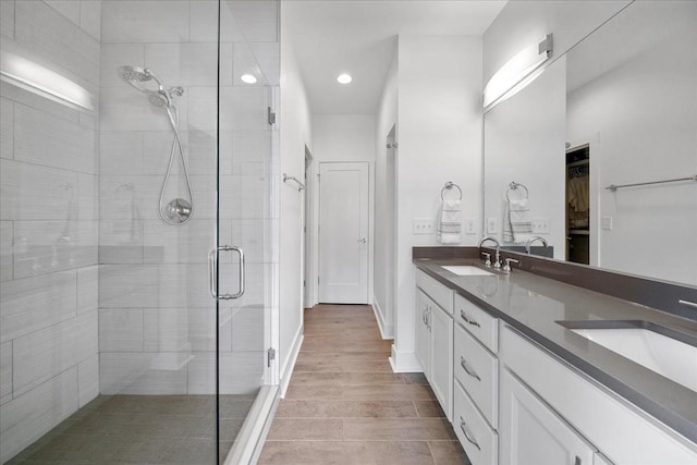 2123A 14th Ave N, Nashville, TN 37208 - full bath with a shower stall, a sink, a spacious closet, and double vanity
