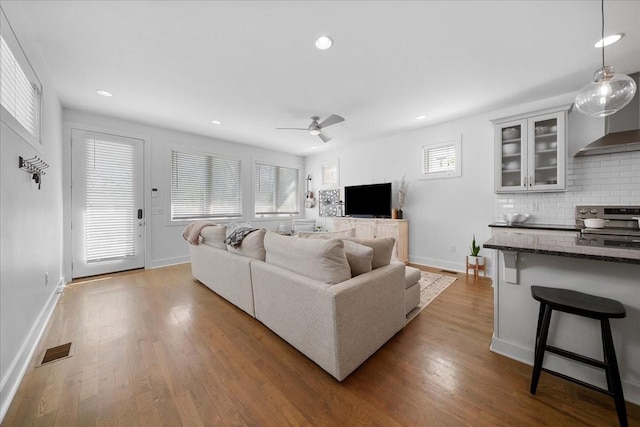 2123A 14th Ave N, Nashville, TN 37208 - living room featuring wood finished floors, a ceiling fan, visible vents, and recessed lighting