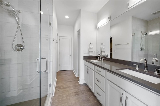 2123A 14th Ave N, Nashville, TN 37208 - bathroom with visible vents, a sink, and a shower stall