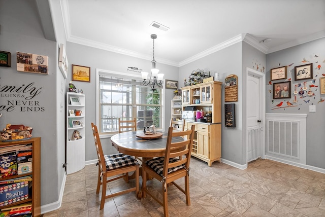 1438 Millet Dr, Clarksville, TN 37040 - dining space featuring a chandelier, ornamental molding, light stone finish flooring, and baseboards