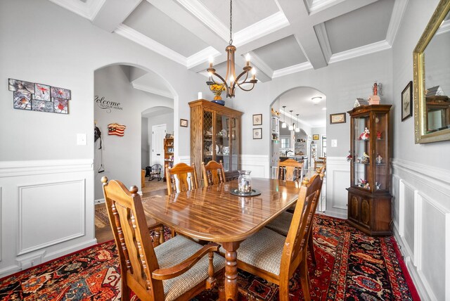 1438 Millet Dr, Clarksville, TN 37040 - dining room with coffered ceiling, a chandelier, beamed ceiling, arched walkways, and ornamental molding