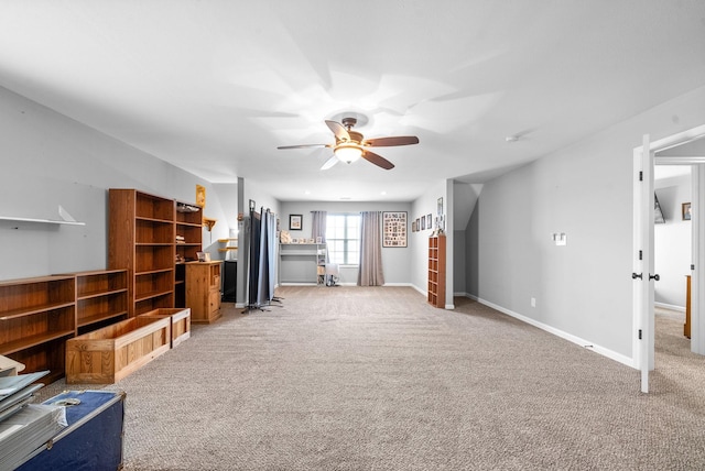 1438 Millet Dr, Clarksville, TN 37040 - unfurnished living room with a ceiling fan, light colored carpet, and baseboards