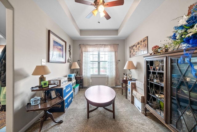 1438 Millet Dr, Clarksville, TN 37040 - living area with carpet floors, ceiling fan, a tray ceiling, and baseboards